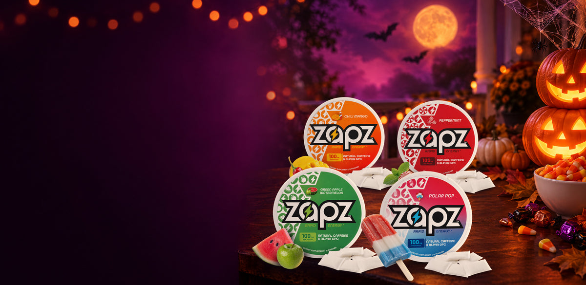 ZAPZ Energy Pouches in Chili Mango, Peppermint, Green Apple Watermelon and Polar Pop on a Halloween porch table with jack-o'-lanterns